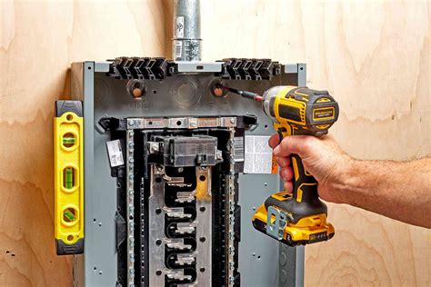 drilling into the back of the electric box|drilling extra holes in electrical panel.